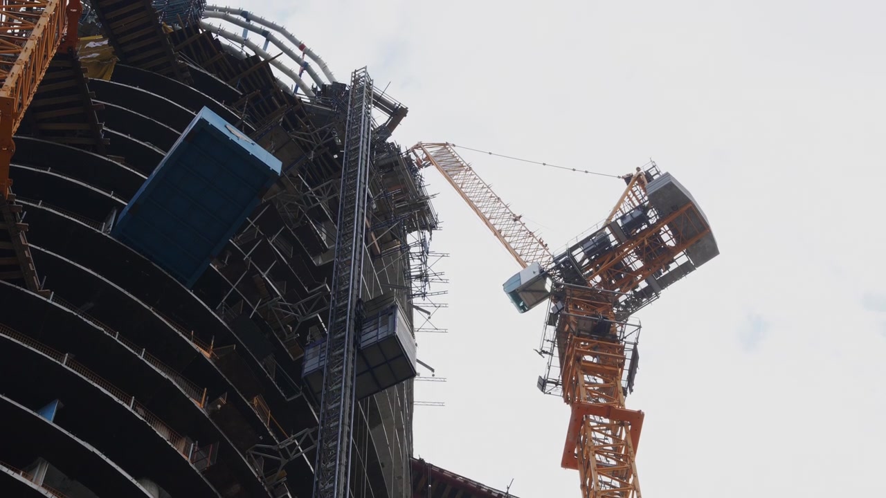Tower Crane Operating at High-Rise Construction Site