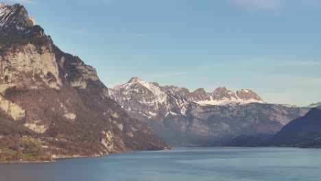 majestic walensee panorama. snow-capped peaks overlook the serene lake. a breathtaking swiss landscape. ideal for nature and travel content.