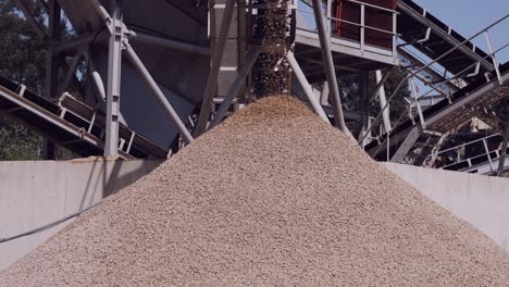 pouring gravel from conveyor: a seamless flow of yellow stones