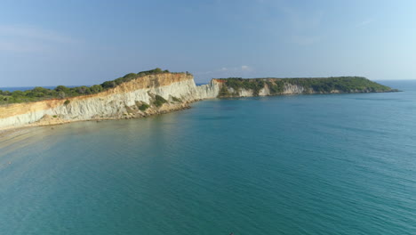 Scenic-aerial-view-over-turquoise-ocean-towards-Greek-Zykynthos-island-idyllic-travel-destination