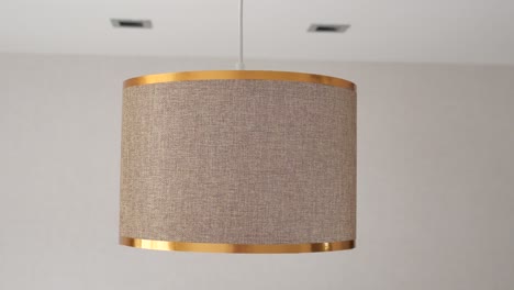 hanging cylinder lamp with gold trim