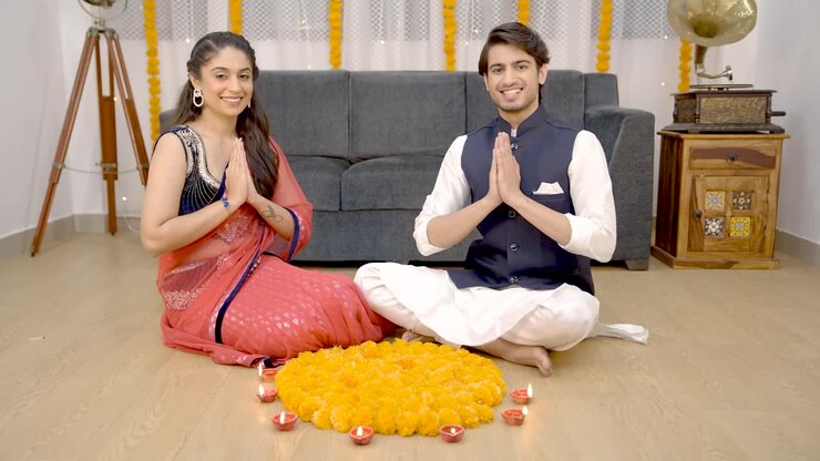 Indian couple praying for prosperity