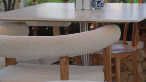 a close-up of a modern, cozy dining table.