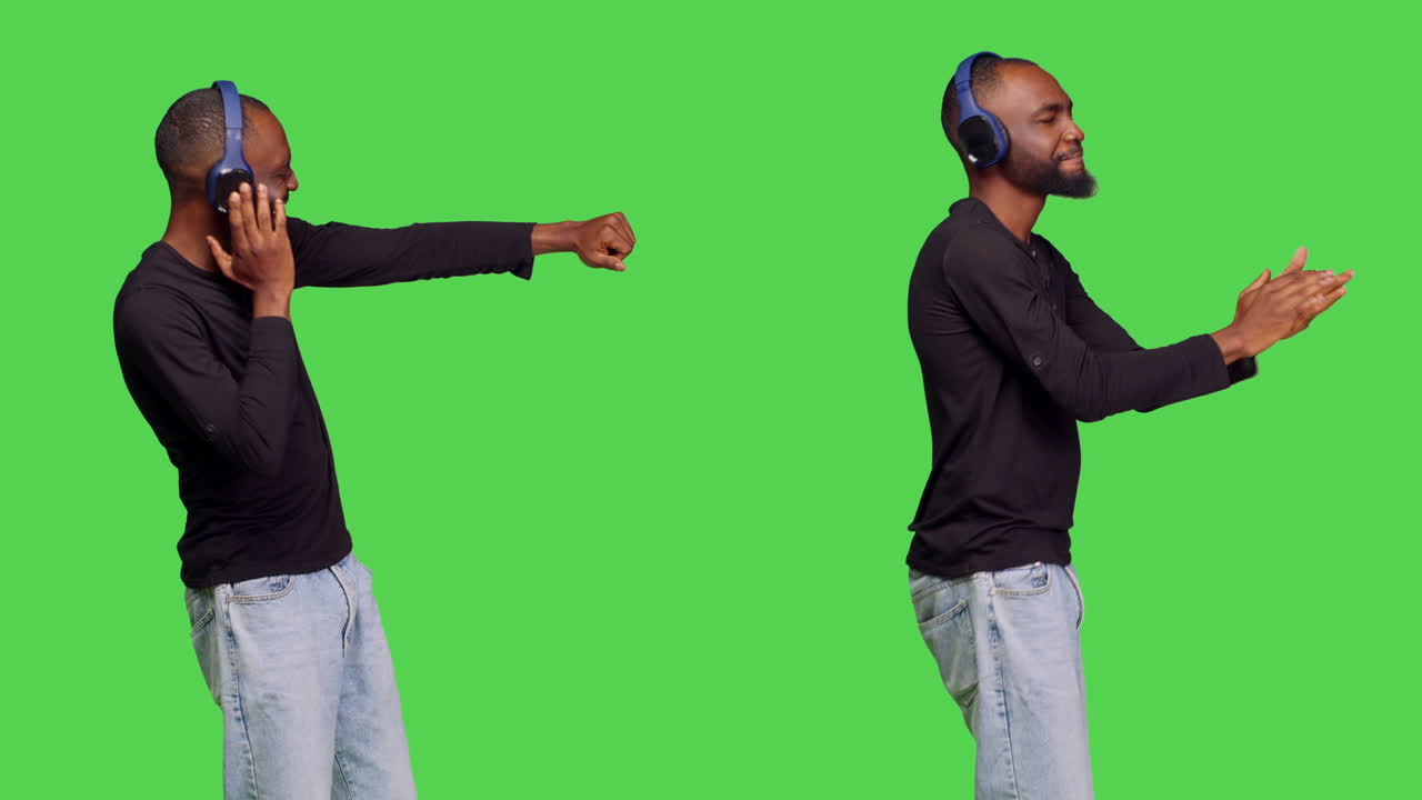 Man dancing with headphones on green screen