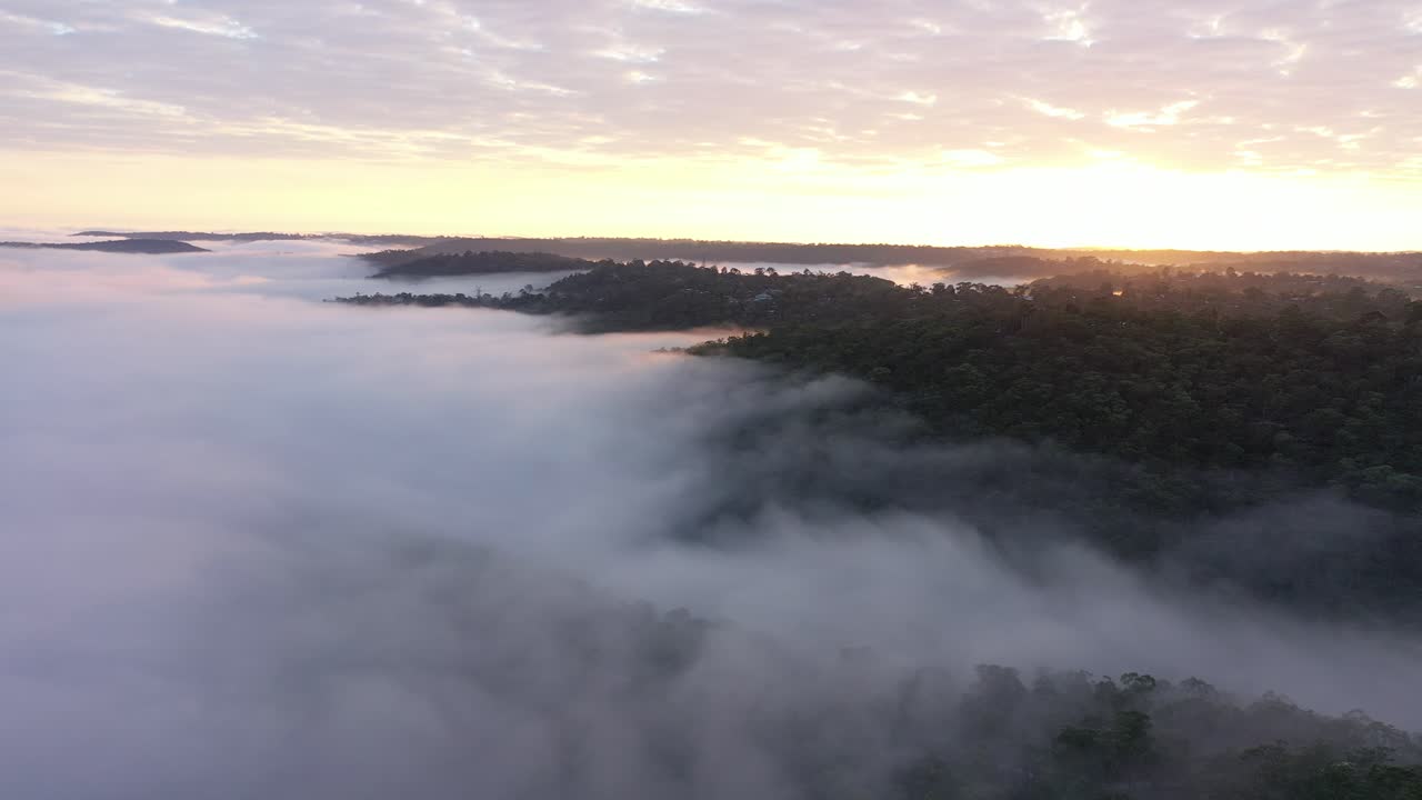 Misty Cloud Sunrise Drone Flyby across hills