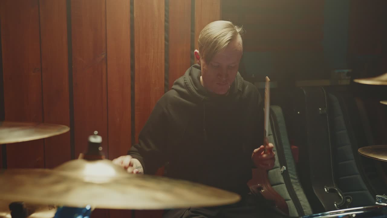 Drummer Playing Drums in a Studio