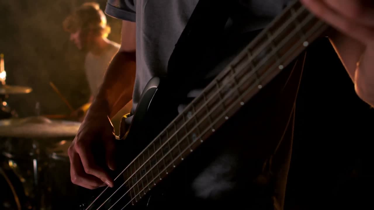 Close up of man playing the bass