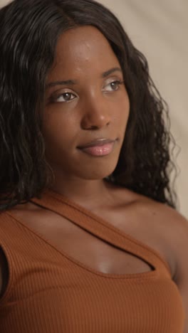 studio portrait shot of young woman feeling softness of skin after using beauty product 2