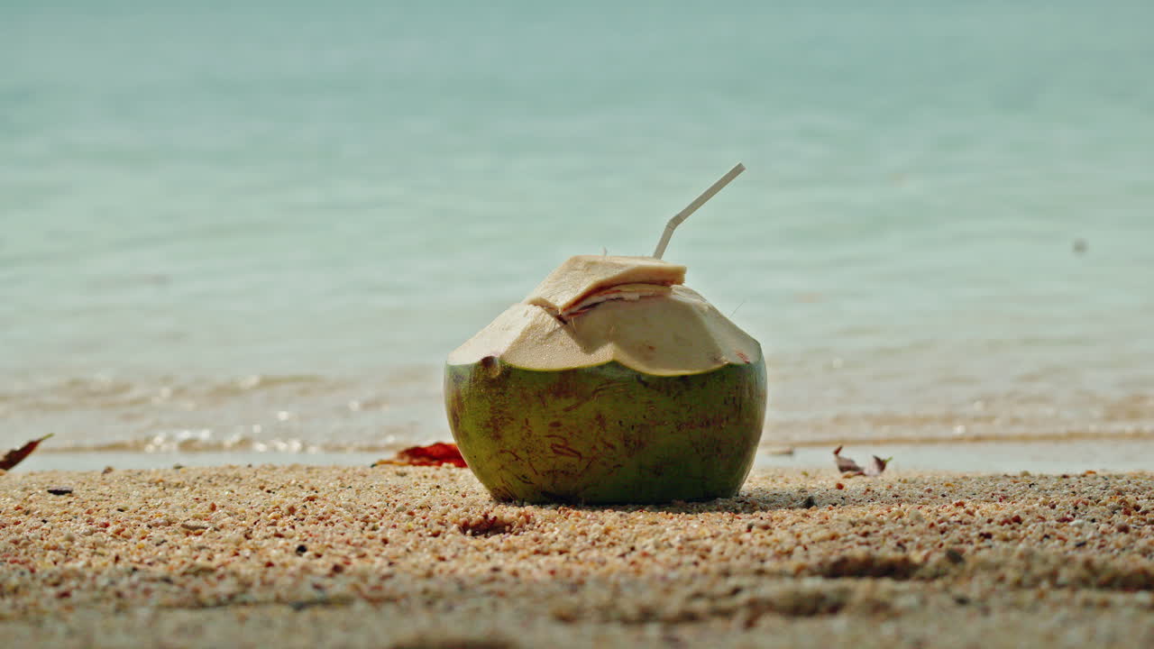 Coconut drink on the beach