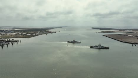 aerial view of ferrys with cars crossing aransas pass in texas