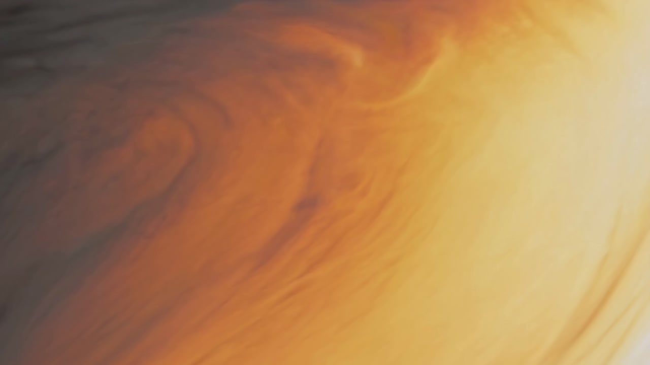 Abstraktes Videokonzept mit einem dynamischen Wirbel warmer Farben.