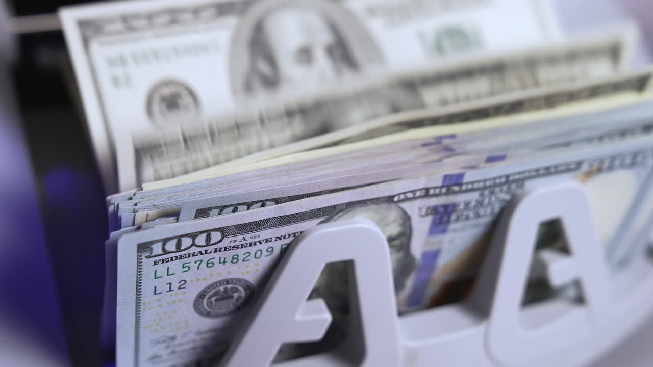 Bank cash counter machine with a lot of dollars. Finance business money counting. Cropped view. Money concept