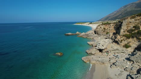 mediterranean coastline with rocky shores and serene beaches washed by the azure sea's gentle waves