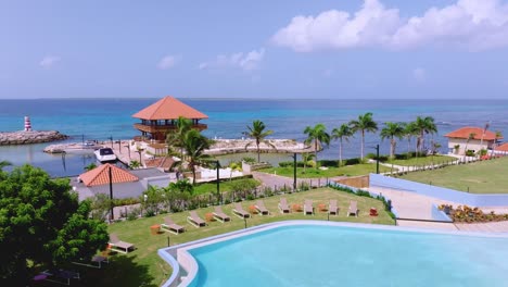 Aerial-ascending-shot-of-Swimming-pool-and-marina-in-front-of-Hilton-Garden-Inn-Hotel-in-La-Romana