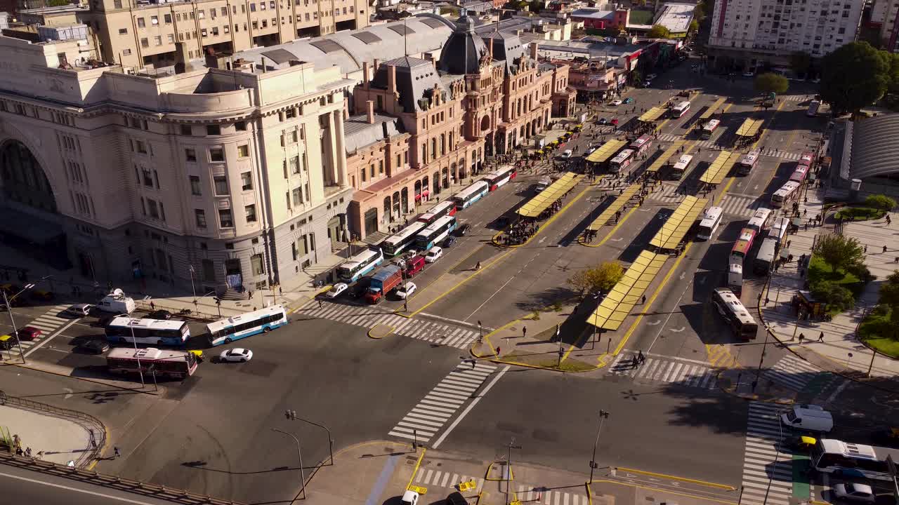 Aerial View of a Major City Transportation Hub with Buses and Historic Architecture