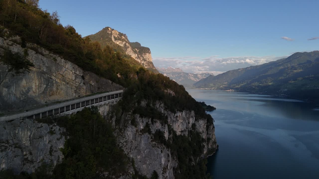 Mountain side overpass car road lake Walensee view Swiss Alps Mountains