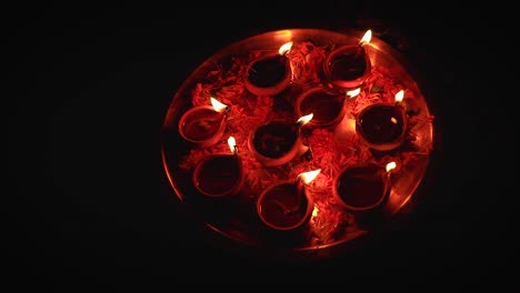 oil lamps many in plate isolated with with black background for festival celebration