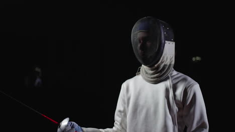 fencer in action during a fencing match