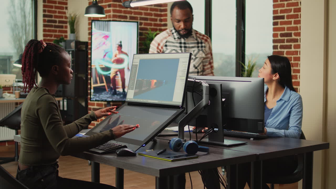 African american worker using game developing software