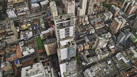 Bogotá-Colombia-Vista-Aérea-V26-A-Vista-De-Pájaro,-Dron-Vuela-Alrededor-Del-Edificio-Más-Alto-De-Bd-Bacata-Que-Captura-El-Paisaje-Urbano-De-Alemania,-La-Paz,-Santa-Fe-Y-El-Centro-De-La-Ciudad---Filmado-Con-Cine-Mavic-3---Noviembre-De-2022