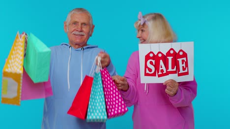 senior grandparents hold shopping bags, sale inscription banner text, advertising price discounts