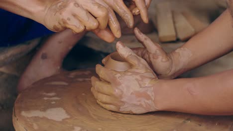 potter teaches the student the art of clay pottery, video in 4k