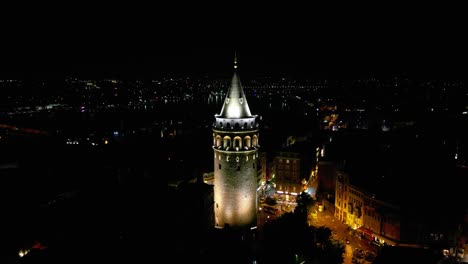 Cinematic-Establishing-Drone-Video-of-the-Galata-Tower-at-Night-in-Beyoglu-District-In-Istanbul,-Turkey