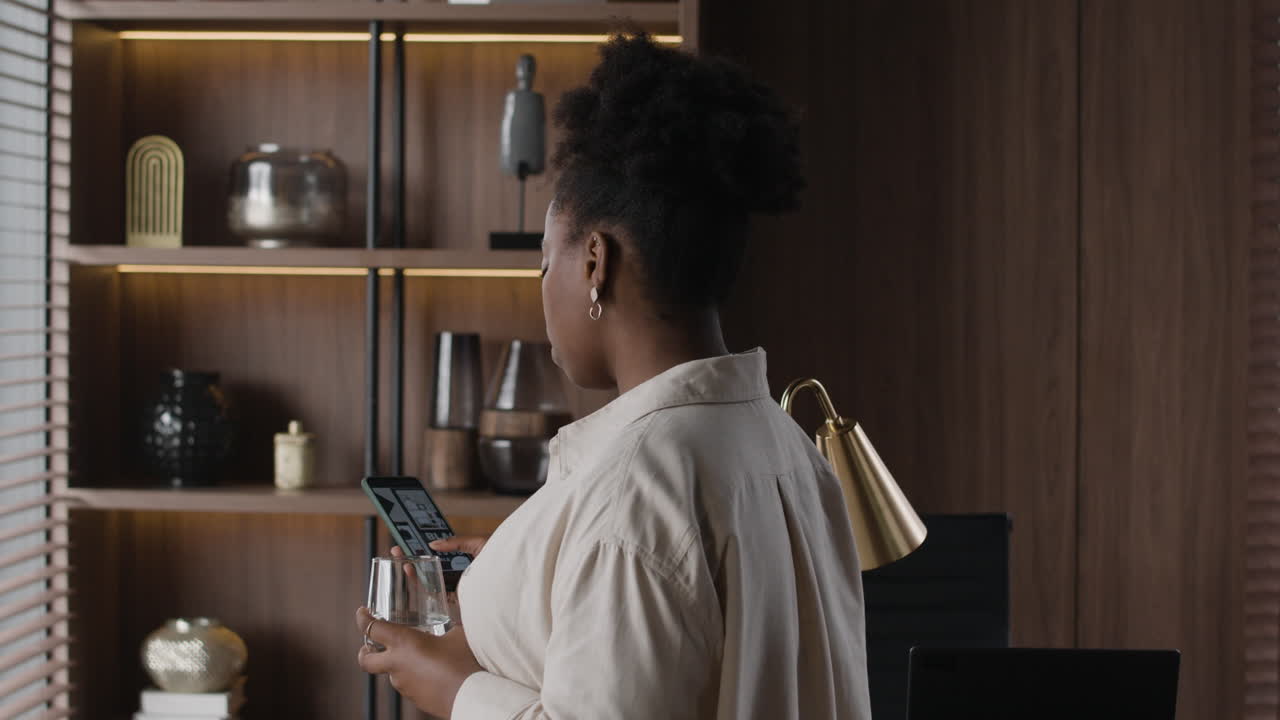 Woman using her phone in an office setting