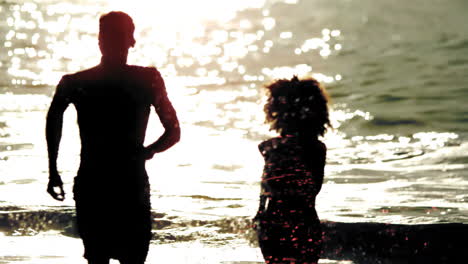 friends running out the sea on the evening