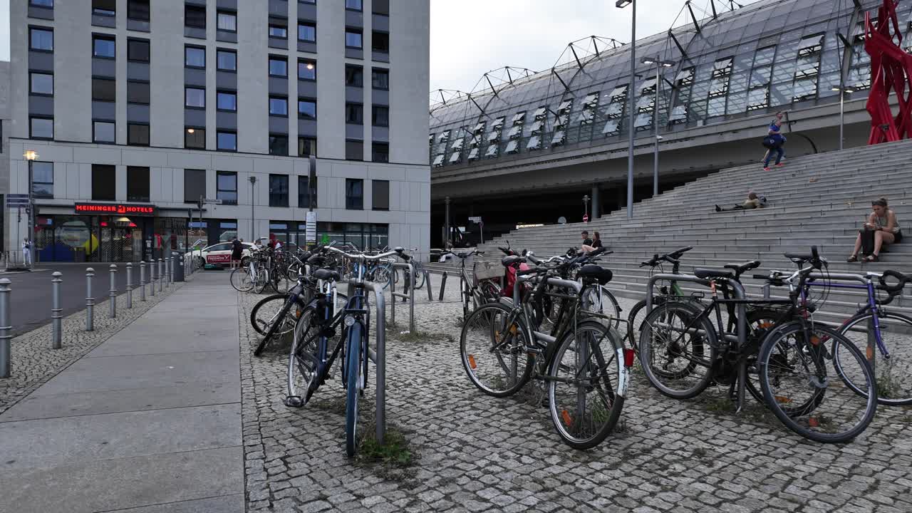 POV view of a bike park station outside Berlin Central Station, showcasing modern architecture and urban transport solutions.
