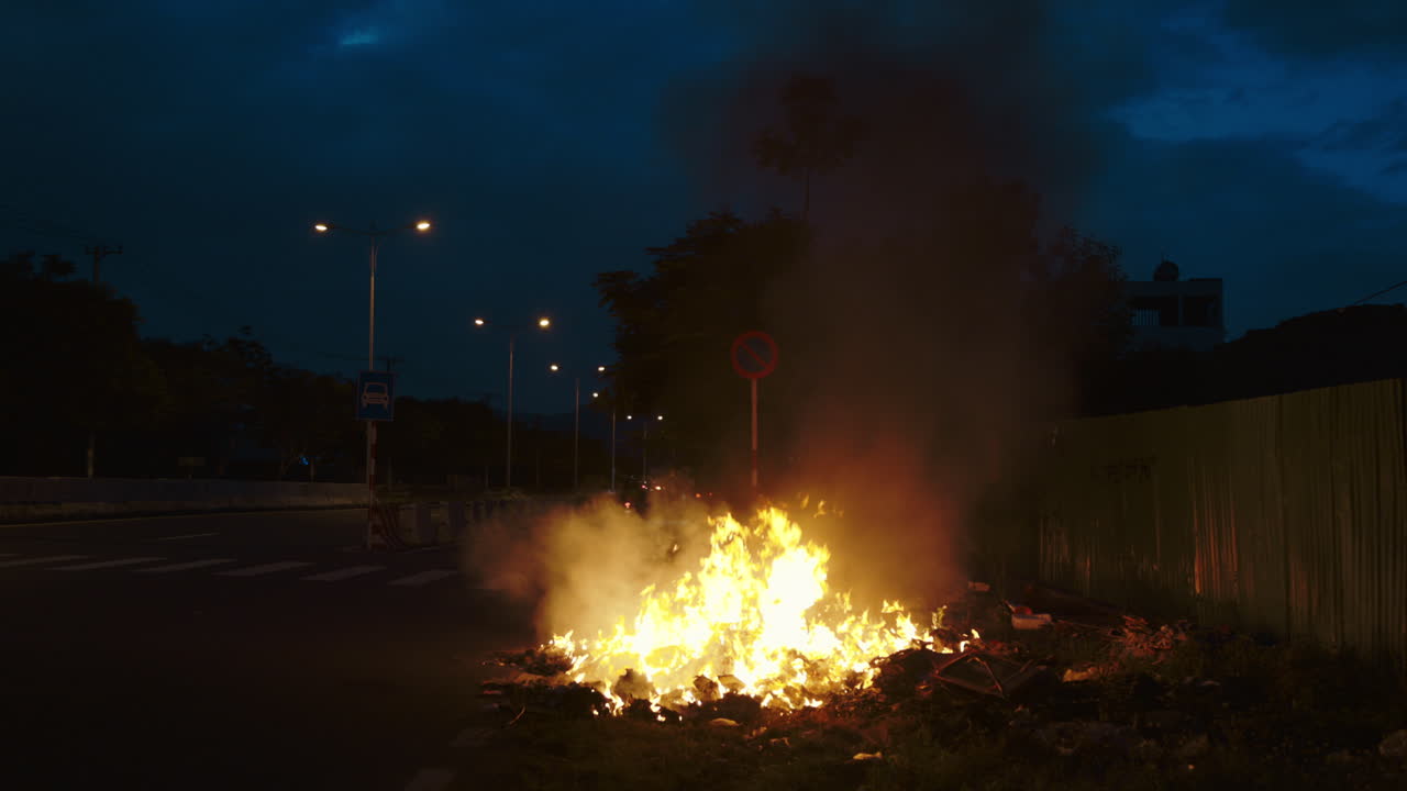 Roadside Trash Fire at Night