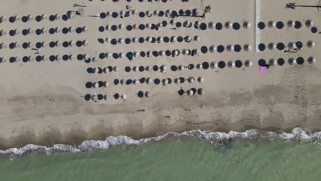 Overhead-aerial-view-of-beach-in-Bay-of-Lalzi-along-the-Albanian-coastline,-Europe