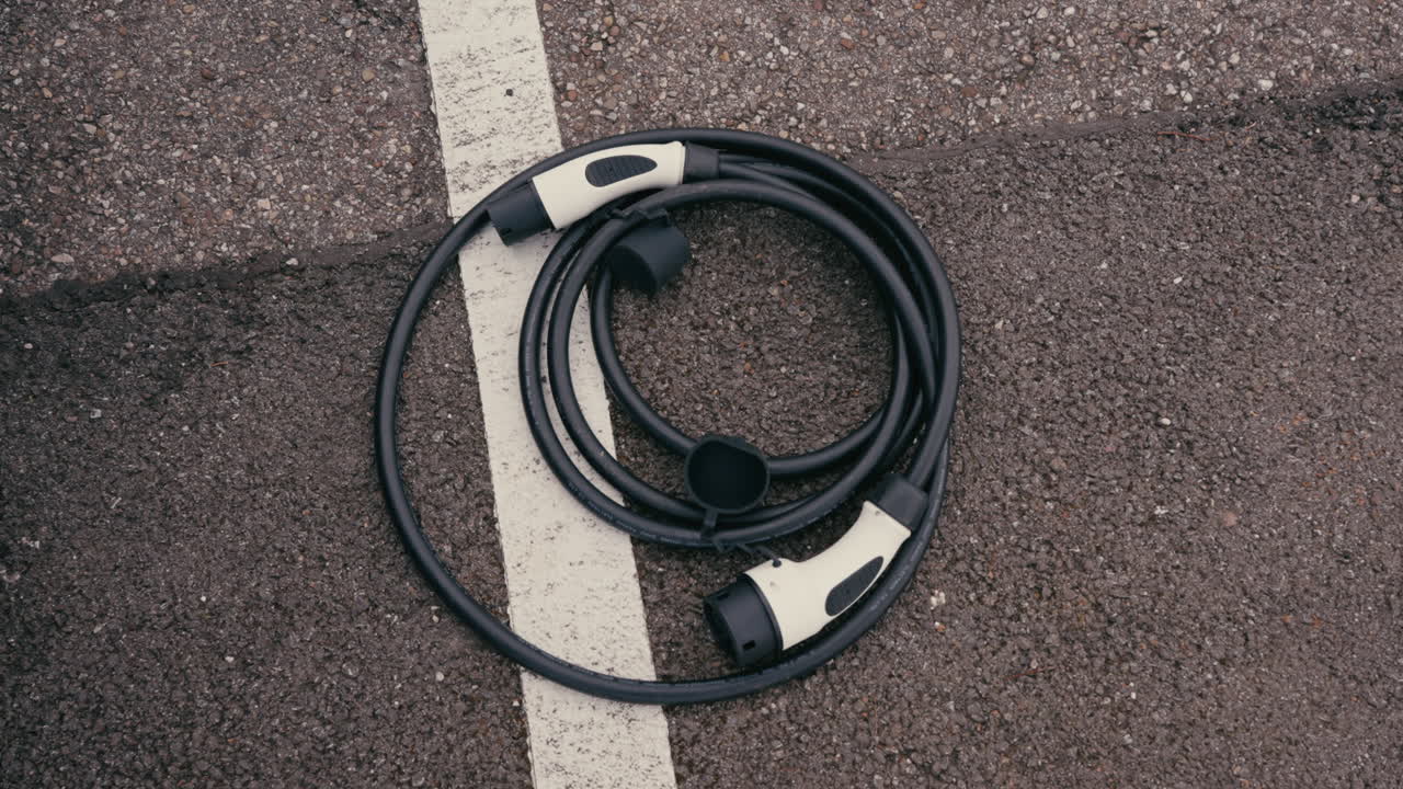 Electric Vehicle Charging Cable on Pavement