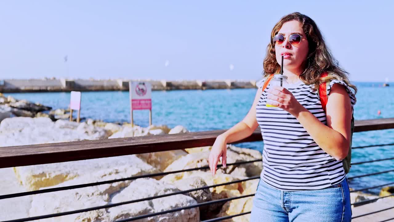 Portrait Of Female Traveler Drinking Cocktail In Jaffa