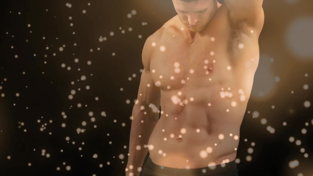 Torso di uomo muscoloso con effetto bokeh dorato