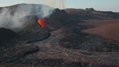 Magma-spurts-from-crater-fissure-of-erupting-volcano-on-sunny-day,-Iceland