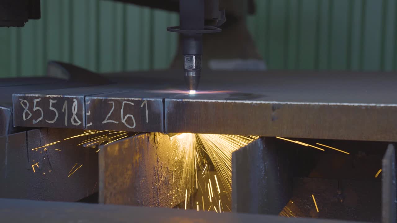 Shaky closeup shot of CNC cutter milling metal plate