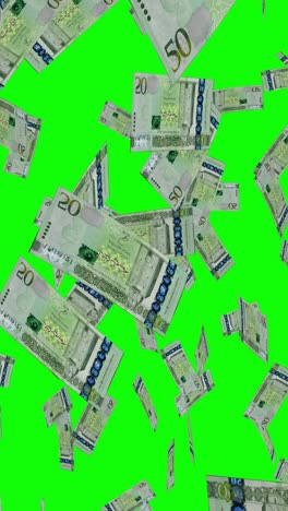 falling saudi riyal notes on green screen