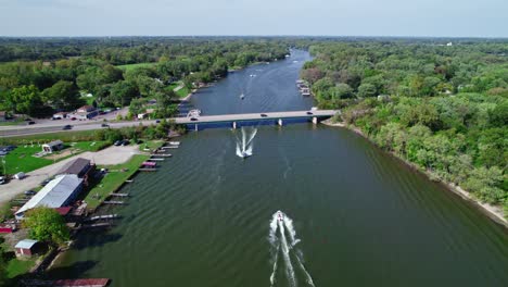 aerial during crystal clear sunshine day above fox river in crystal lake, illinois