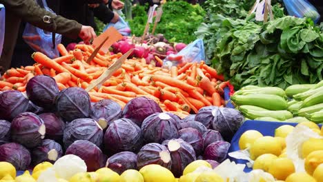 a bustling farmer's market with colorful vegetables and people shopping for fresh produce.