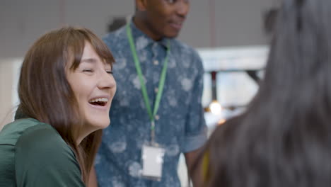 woman smiles and laughs during meeting