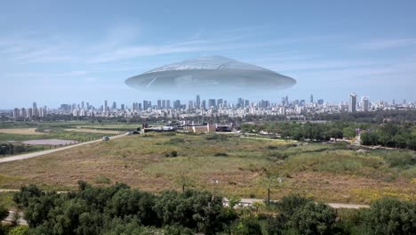 massive ufo flying saucer hovering over large city aerial view