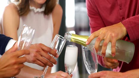 business executive a having a glasses of champagne in office