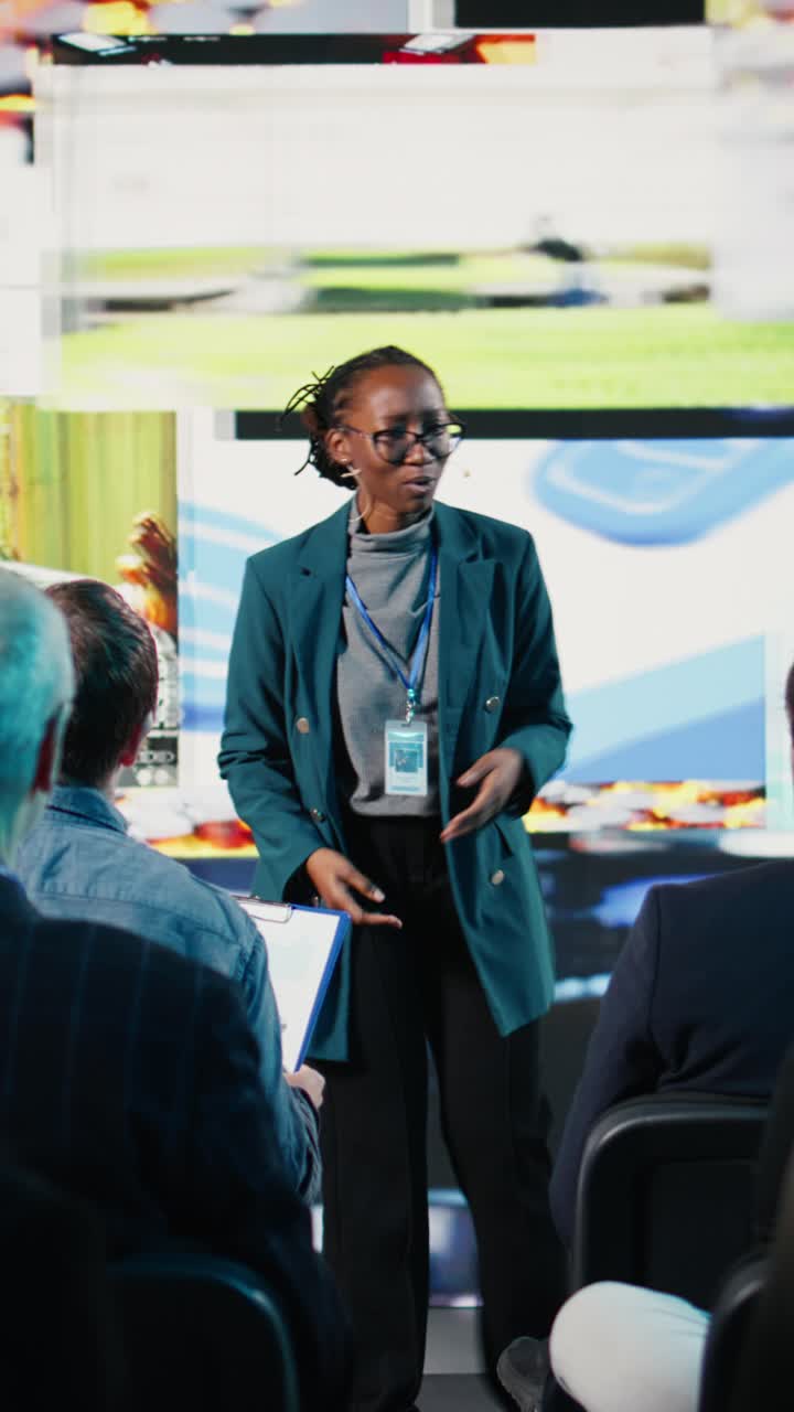 Vertical Video Black young adult presenter during social media presentation at business summit