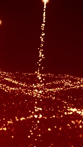 golden glitter particles on red background