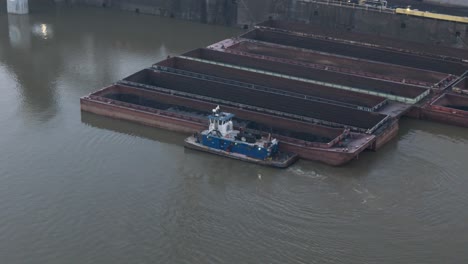 a tugboat tends to barges on the monongahela river at the us steel coke plant near pittsburgh pennsylvania