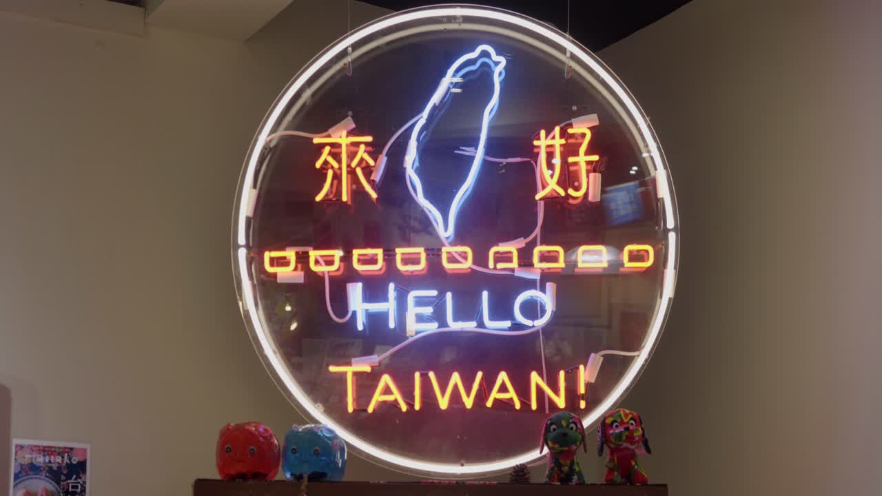 Letrero circular de neón brillante iluminado 'Hello Taiwan'