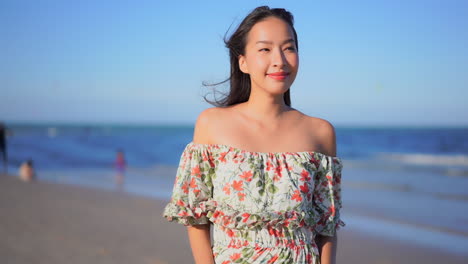 liberated free asian woman cherishing life on beach