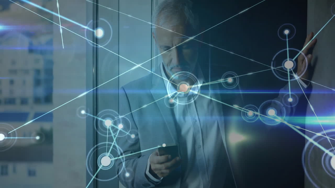 Using smartphone, businessman with network connections animation overlaid