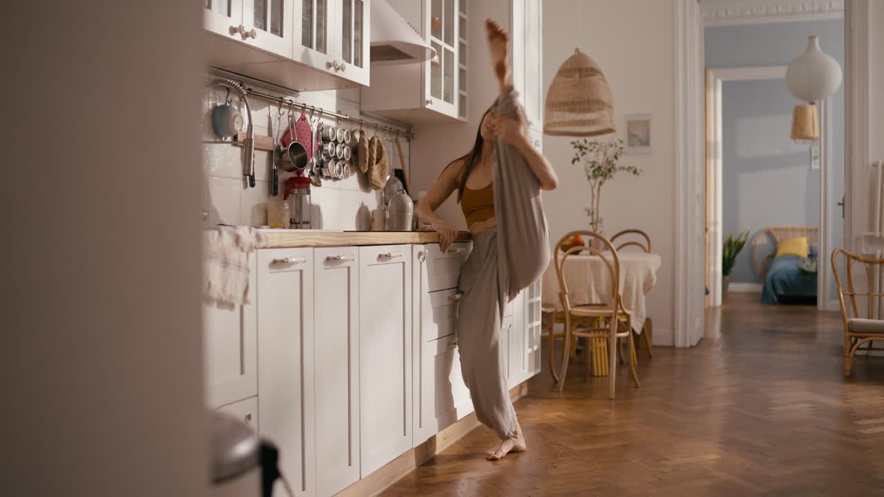 Woman dancing in her kitchen